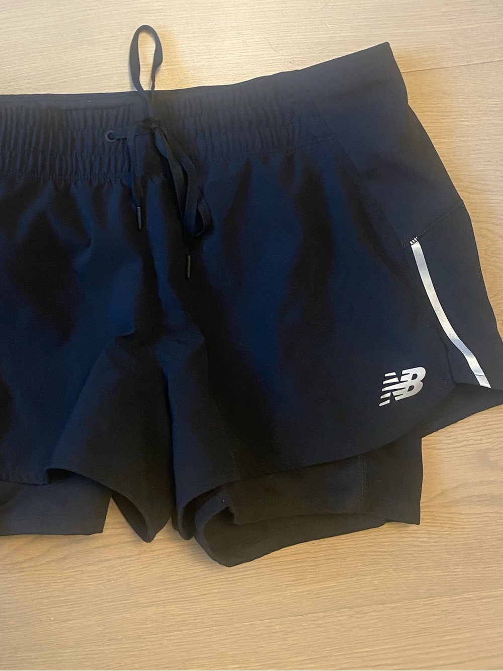 New Balance Black Women's Layered Running Shorts with Reflective Accents